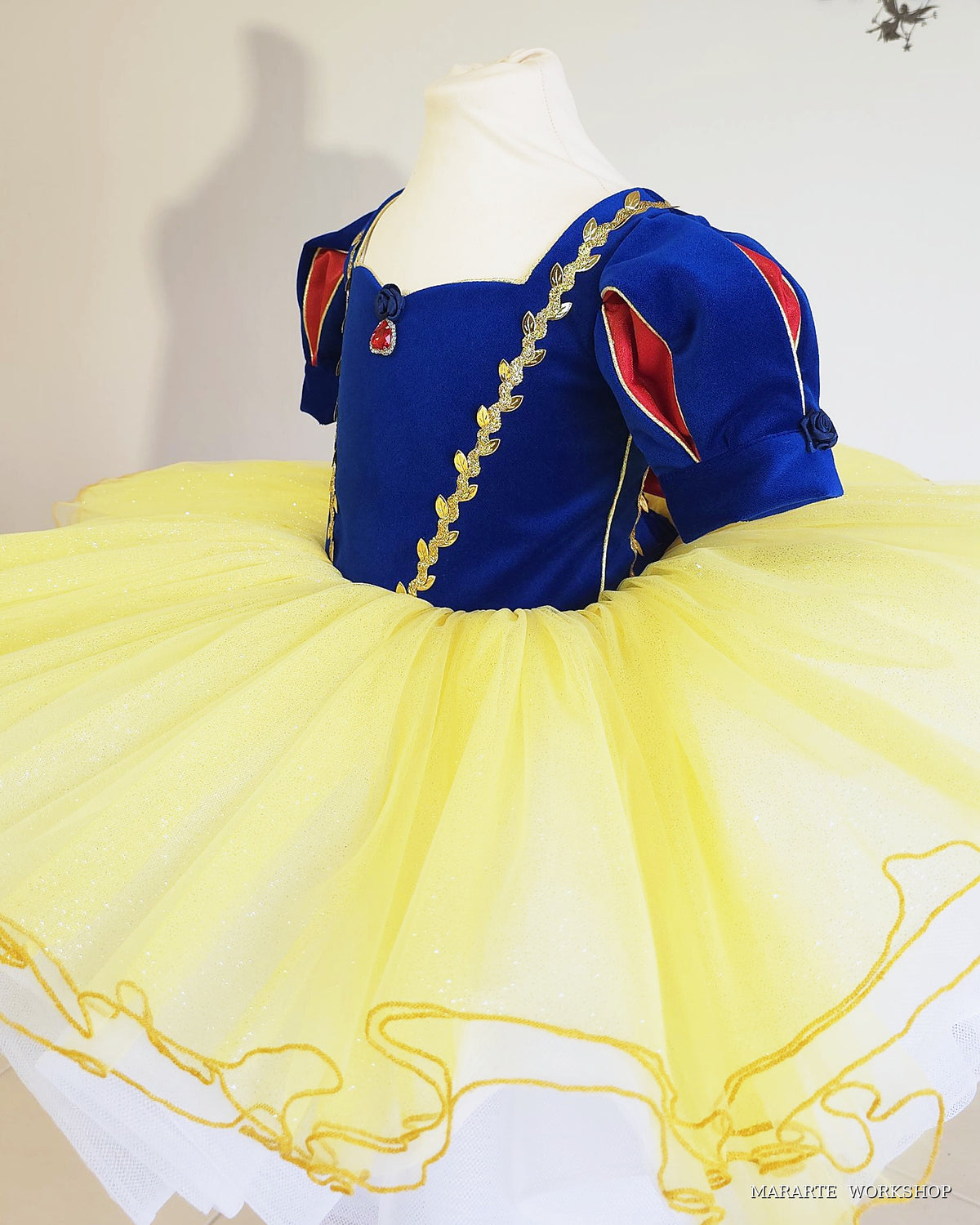 Snow White inspired princess dress, side view: velvet puff sleeves with red satin inserts and full yellow tutu skirt with white petticoat - Mararte Workshop