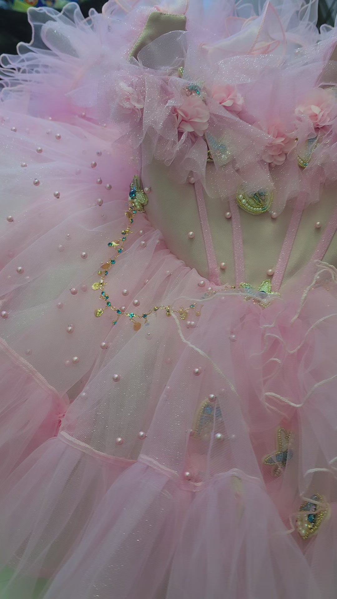 pink and white girls dress on a manequin